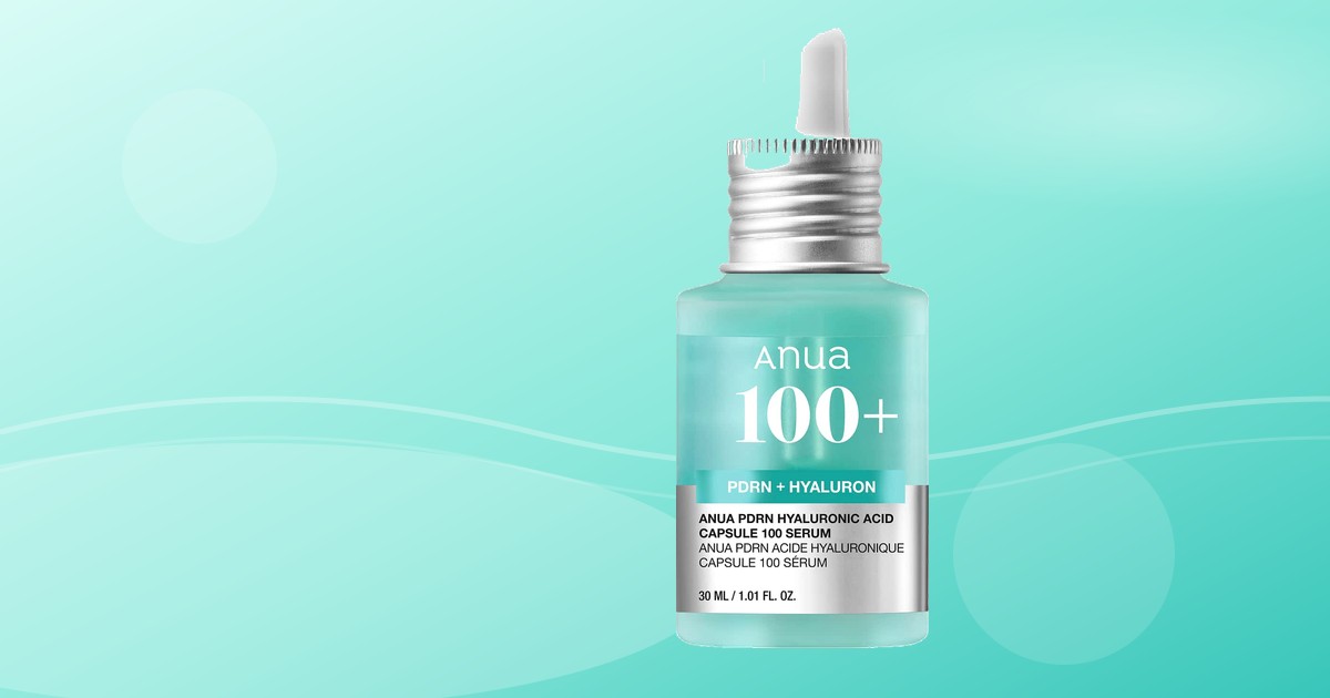 Anua PDRN Capsule 100 Serum bottle on a turquoise water-toned background