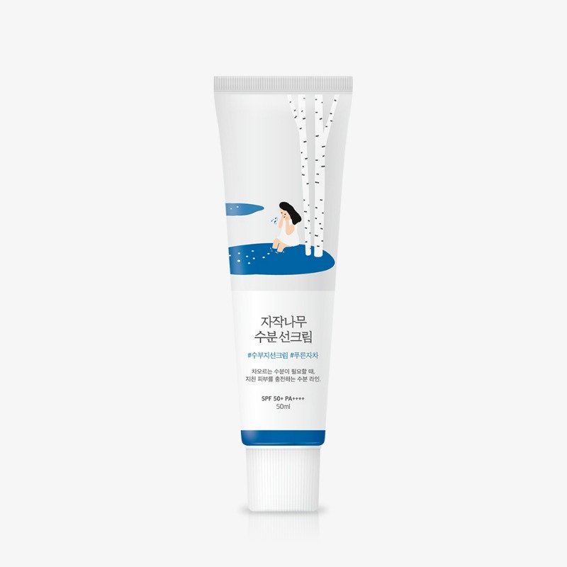 ROUND LAB Birch Juice Moisturizing Sunscreen white 50ml tube with blue band and birch illustration on a plain background