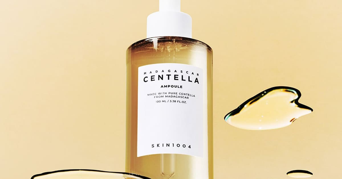 SKIN1004 Madagascar Centella Ampoule 100mL with watery swatches on a warm cream background