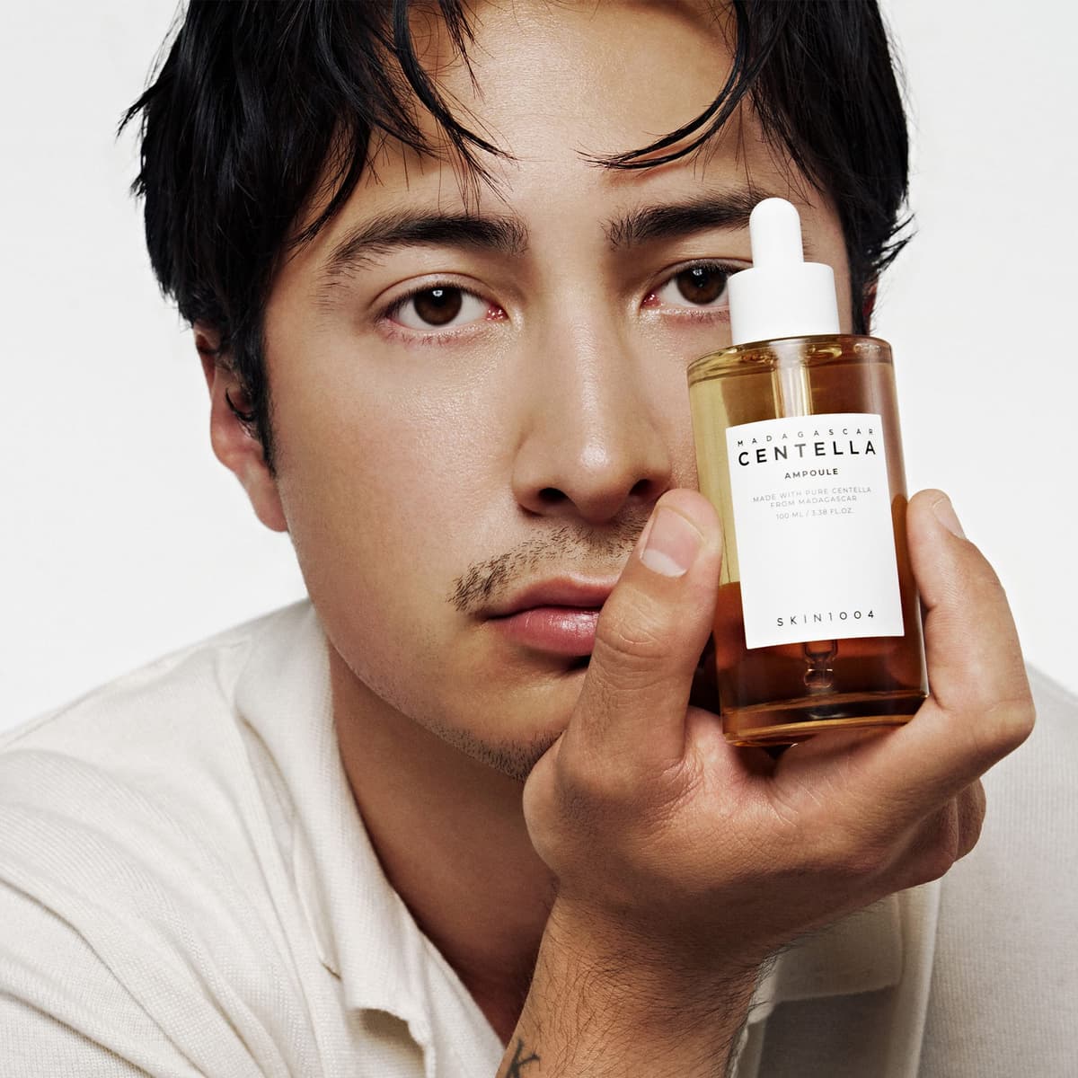 SKIN1004 Madagascar Centella Ampoule bottle shown in an official lifestyle image