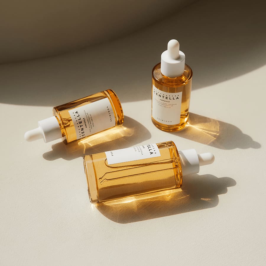 SKIN1004 Madagascar Centella Ampoule bottles arranged in an official product texture scene